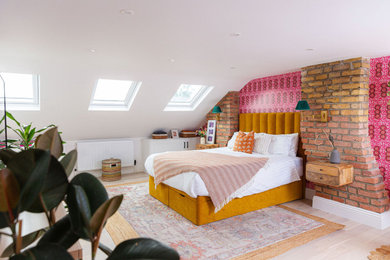 Design ideas for a bohemian master bedroom in London with wallpapered walls.