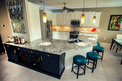 Design ideas for a mid-sized transitional l-shaped open plan kitchen in Orlando with an undermount sink, shaker cabinets, white cabinets, granite benchtops, multi-coloured splashback, stone slab splashback, stainless steel appliances, ceramic floors, a peninsula and beige floor.