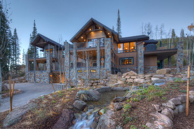 Example of a large mountain style multicolored three-story mixed siding exterior home design in Denver with a shingle roof