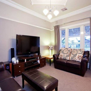 Home theater - mid-sized traditional enclosed carpeted home theater idea in Adelaide with brown walls