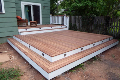 Example of a mid-sized backyard deck design in New York