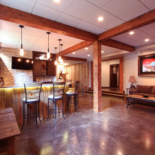 Inspiration for a rustic look-out basement in Other with beige walls and concrete flooring.