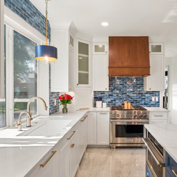 Stainless Steel Gas Range with Custom Wood Vent Hood and Blue Backsplash