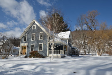 Mid-sized traditional blue two-story wood gable roof idea in Boston