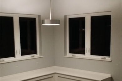 Inspiration for a mid-sized transitional enclosed dark wood floor and brown floor living room remodel in Other with blue walls, no fireplace and no tv