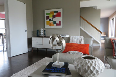 Inspiration for a mid-sized modern enclosed and formal dark wood floor and brown floor living room remodel in DC Metro with gray walls and no fireplace