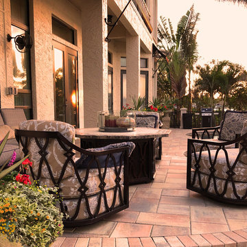 Mediterranean style patio set up higher for maximizing views of the water
