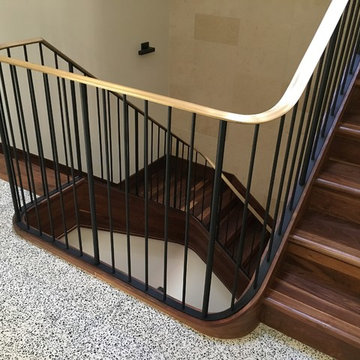 Walnut Stairs with Bronze Handrail and Iron Balusters