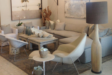 Large beach style open concept concrete floor living room photo in Jacksonville with white walls, no fireplace and no tv