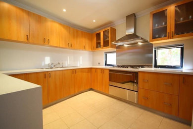 Inspiration for a kitchen in Perth with quartz benchtops and stainless steel appliances.