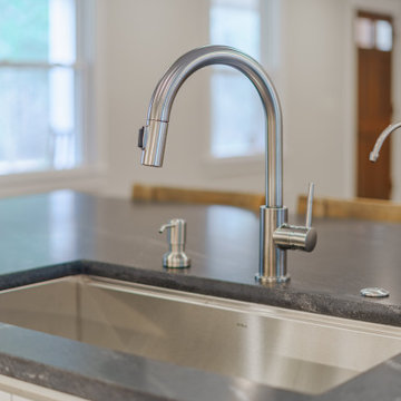 Traditional kitchen renovation faucet and countertop details