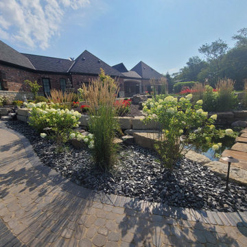 Estate Poolside Landscape & Hardscape Retreat with Custom Waterfeature