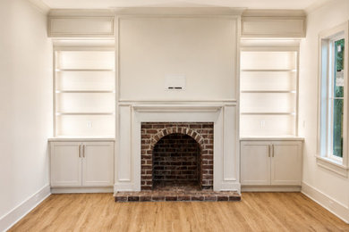 Large arts and crafts open concept beige floor living room photo in Charleston with a brick fireplace