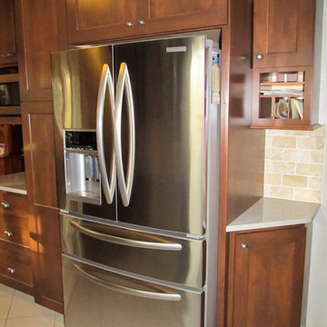 Select Alder Kitchen with Geneva Quartz Countertops.
