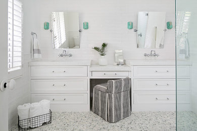 Inspiration for a mid-sized contemporary master bathroom in Tampa with beaded inset cabinets, white cabinets, a curbless shower, a two-piece toilet, white tile, ceramic tile, white walls, marble floors, an undermount sink, engineered quartz benchtops, green floor and a hinged shower door.