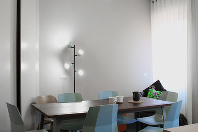 Example of a minimalist dining room design in Other