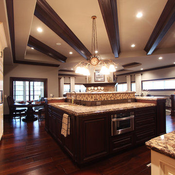 Sink and Microwave Drawer in Island with Dark Stained Maple Cabinets