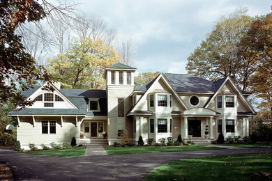 Mid-sized traditional two-storey beige exterior in Boston with wood siding.