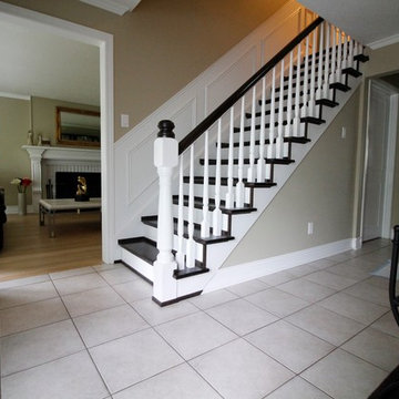 Natural water-based finish with dark stain on red oak stairs and rail.