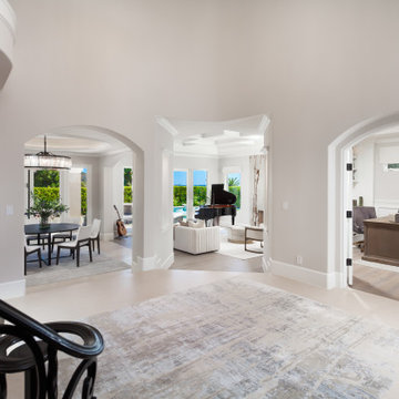 Arched Openings to Dining, Living Room & Office with Backlit Cristallo Fireplace