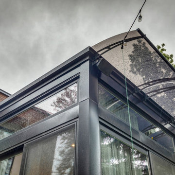 Non - Adjustable Pan Roof by StruXure over Glass Room