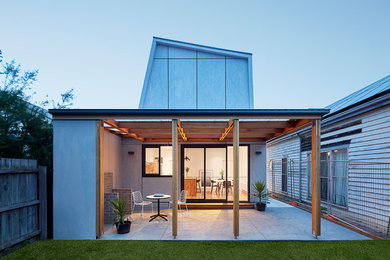 Design ideas for a large contemporary backyard patio in Melbourne with tile and a pergola.