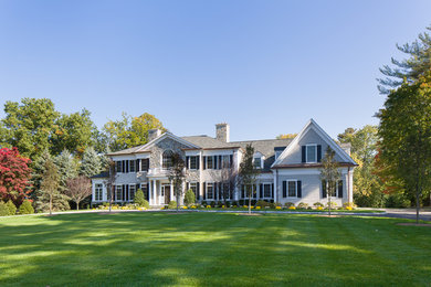 Large transitional gray two-story mixed siding gable roof idea in New York