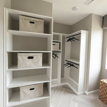 Open Shelving Tower with Adjacent Double‑Hang Sections