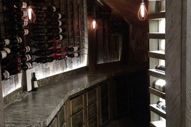 Wine cellar - mid-sized mediterranean concrete floor wine cellar idea in Salt Lake City