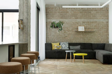Inspiration for a modern light wood floor living room remodel in Tel Aviv with a tv stand