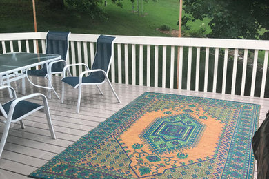 Example of a large classic backyard deck design in Other with no cover
