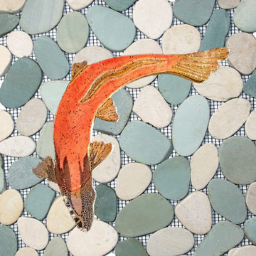Spawning Chinook salmon shaped fish tile on a blue green sliced pebble, rock, an