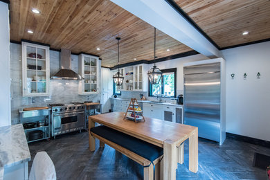Large transitional l-shaped dark wood floor eat-in kitchen photo in Atlanta with an undermount sink, shaker cabinets, white cabinets, granite countertops, white backsplash, subway tile backsplash, stainless steel appliances and no island