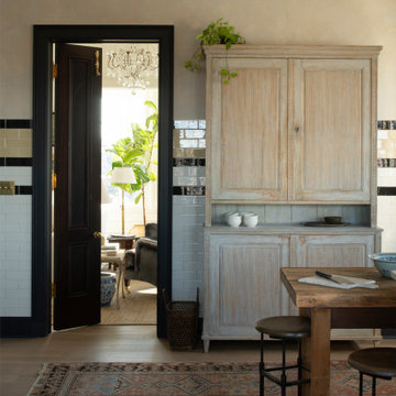 Hand Hewn Timbers in a French Country Kitchen with an Antique Hutch