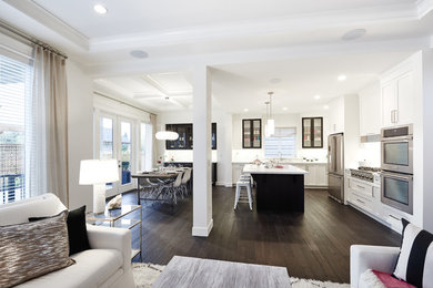 Eat-in kitchen - large transitional dark wood floor eat-in kitchen idea in Vancouver with an undermount sink, glass-front cabinets, white cabinets, quartzite countertops, white backsplash, stainless steel appliances and an island