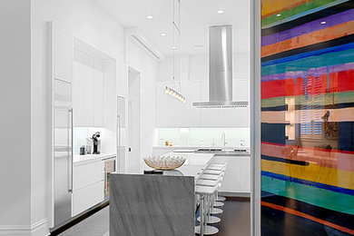 Mid-sized minimalist u-shaped dark wood floor and brown floor eat-in kitchen photo in Chicago with an undermount sink, flat-panel cabinets, white cabinets, marble countertops, white backsplash, mosaic tile backsplash, stainless steel appliances, an island and gray countertops
