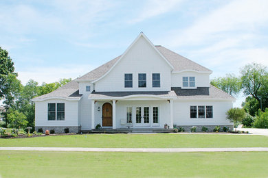 This is an example of a traditional exterior in Grand Rapids with wood siding.