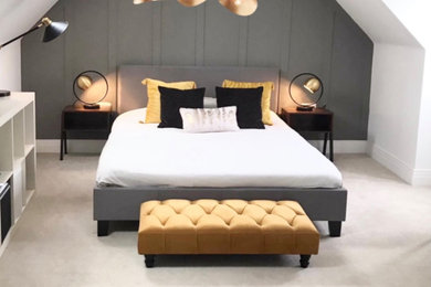Inspiration for a medium sized contemporary guest bedroom in Sussex with grey walls and panelled walls.