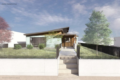 Example of a mid-century modern home design design in Denver