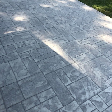 Ashlar slate stamped concrete patio installation