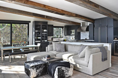 Family room - mid-sized transitional open concept light wood floor family room idea in Montreal with white walls and a wall-mounted tv