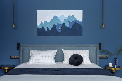 Example of a trendy master bedroom design in Saint Petersburg with blue walls
