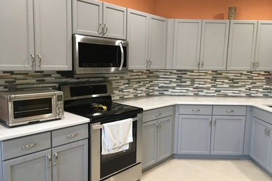 Trendy u-shaped ceramic tile and beige floor open concept kitchen photo in Other with an undermount sink, shaker cabinets, gray cabinets, quartz countertops, gray backsplash, glass tile backsplash, stainless steel appliances, no island and white countertops