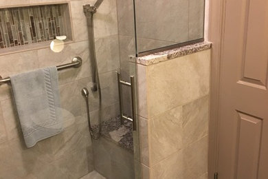 Alcove shower - mid-sized transitional master beige tile and ceramic tile ceramic tile and blue floor alcove shower idea in Other with beige walls and a hinged shower door