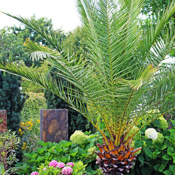 Garten mit Urlaubsflair und Koiteich