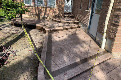 Design ideas for a mid-sized modern full sun front yard concrete paver landscaping in Toronto for summer.