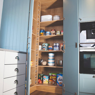 Mid-sized traditional kitchen pantry ideas - Kitchen pantry - mid-sized traditional kitchen pantry idea in Devon with shaker cabinets, blue cabinets and gray countertops
