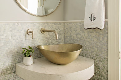 Inspiration for a small transitional multicolored tile and mosaic tile dark wood floor and brown floor powder room remodel in Charleston with gray walls, a vessel sink, quartz countertops and white countertops