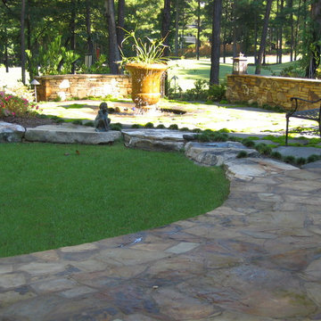 Crescent lawn with flagstone patio