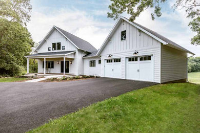 Mid-sized cottage white two-story mixed siding house exterior photo in Other